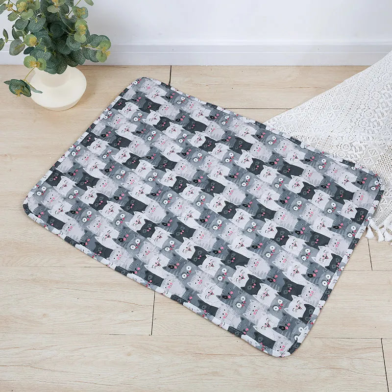Reusable washable pet urine pad with animal print design and waterproof layer.
