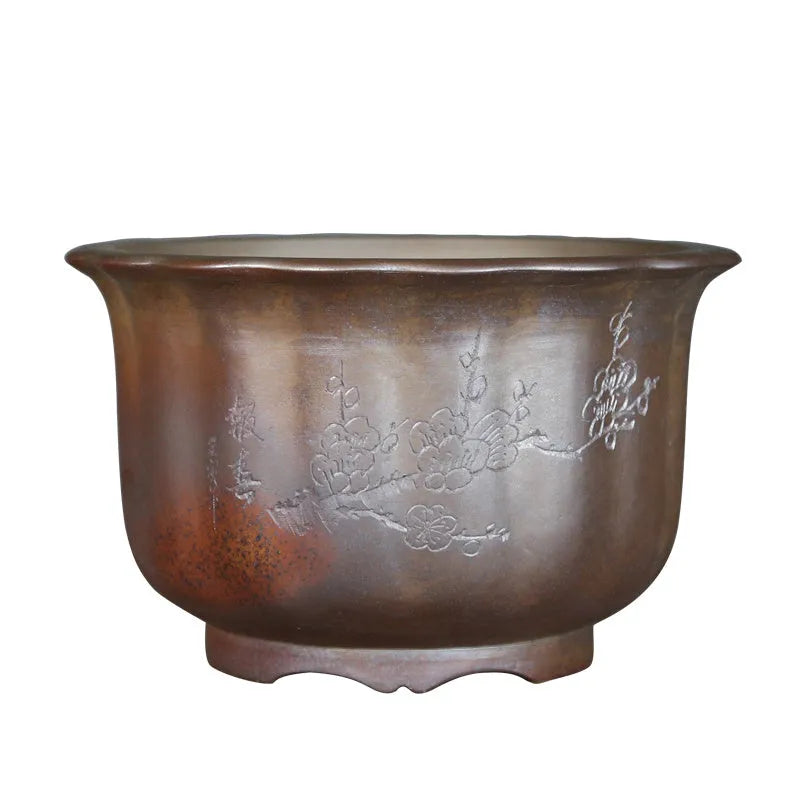 Large indoor ceramic flowerpot with antique carved flower design in purple sand clay