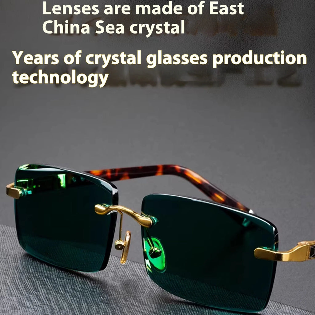 Dark green frameless crystal sunglasses with a glasses case and cleaning cloth.