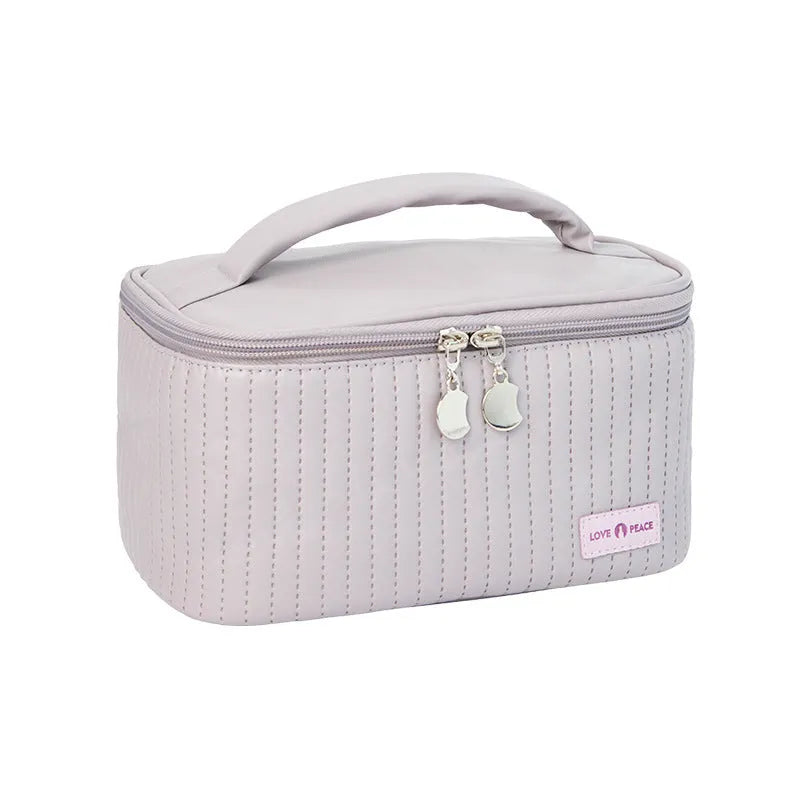 Open-top cake-shaped makeup bag in PU leather, shown in a solid colour from the pink, coffee, beige, blue, green, purple range.
