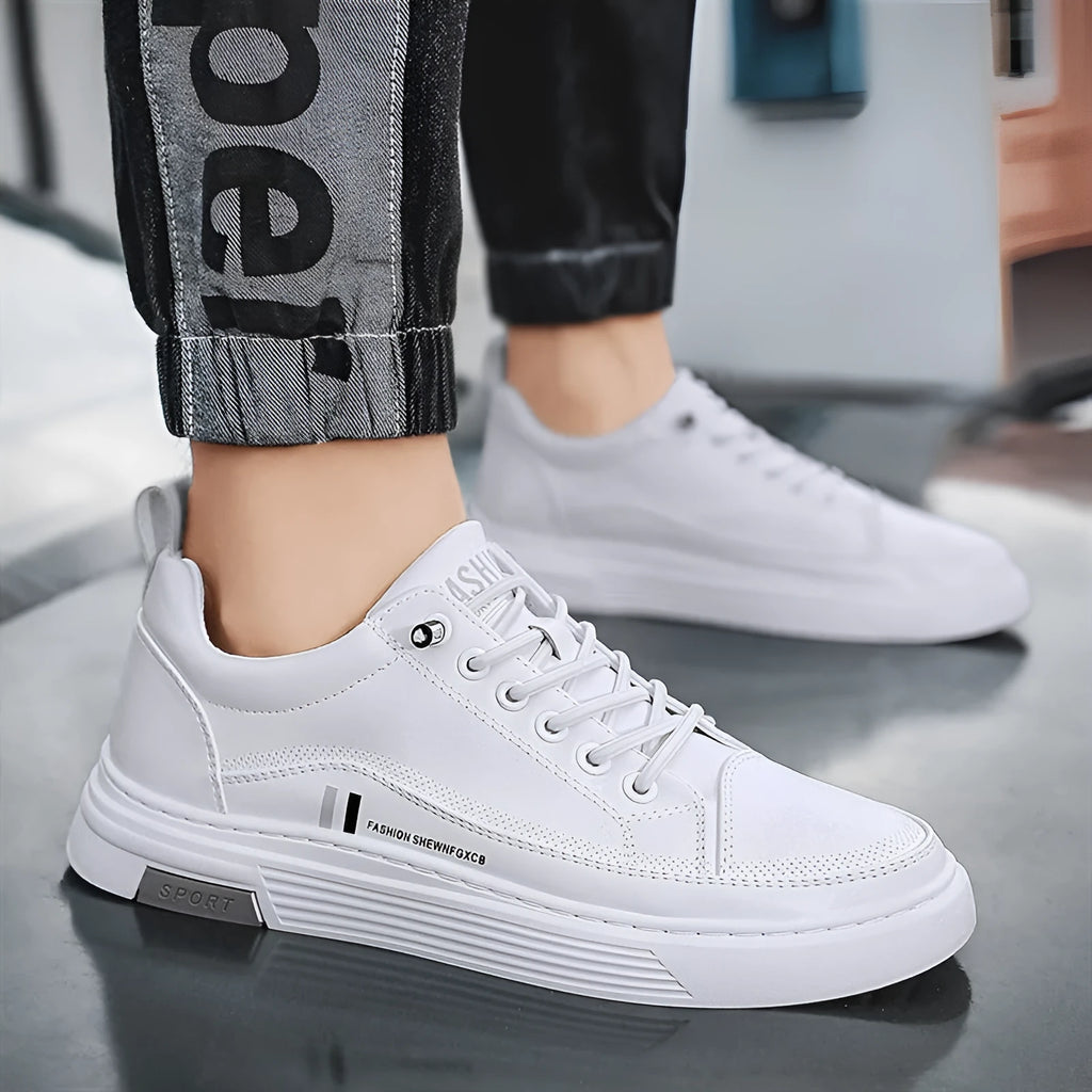 Men's white and black low-top skate shoes with elastic band and microfiber upper.