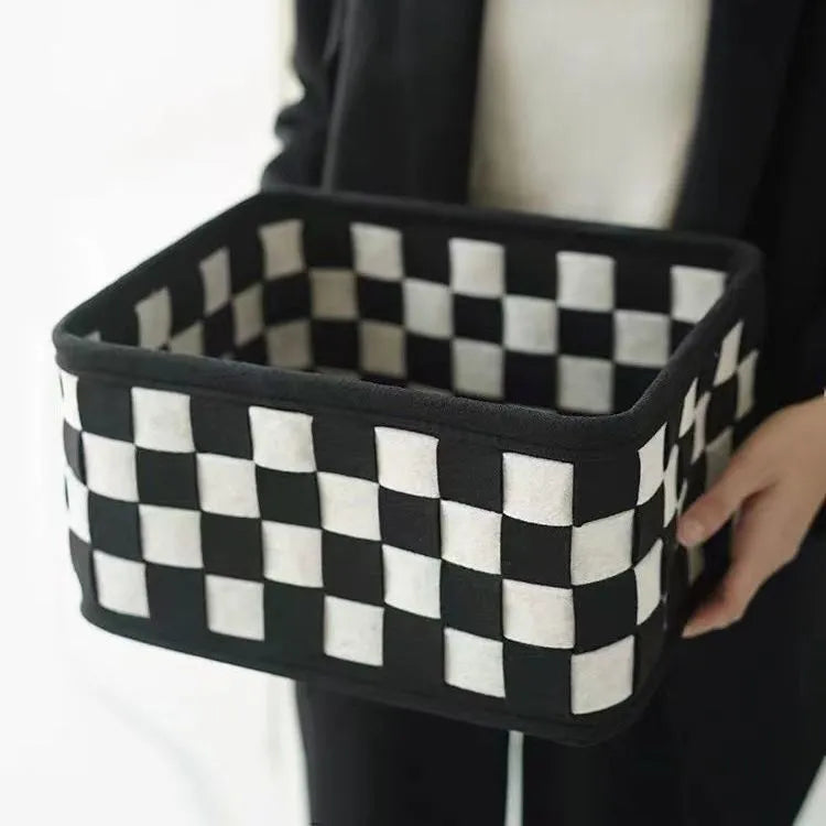 Checkerboard patterned grey felt folding storage basket showing collapsible sides, dimensions 37cm by 29cm by 19.5cm.