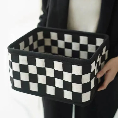 Checkerboard patterned grey felt folding storage basket showing collapsible sides, dimensions 37cm by 29cm by 19.5cm.