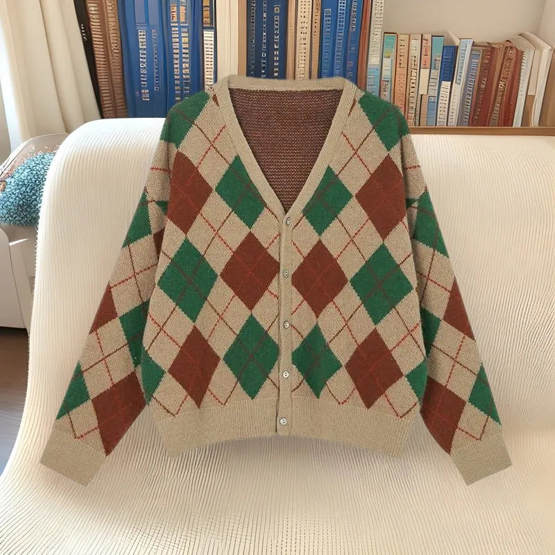 Casual pink knitted cardigan coat with regular sleeves, shown on a hanger.