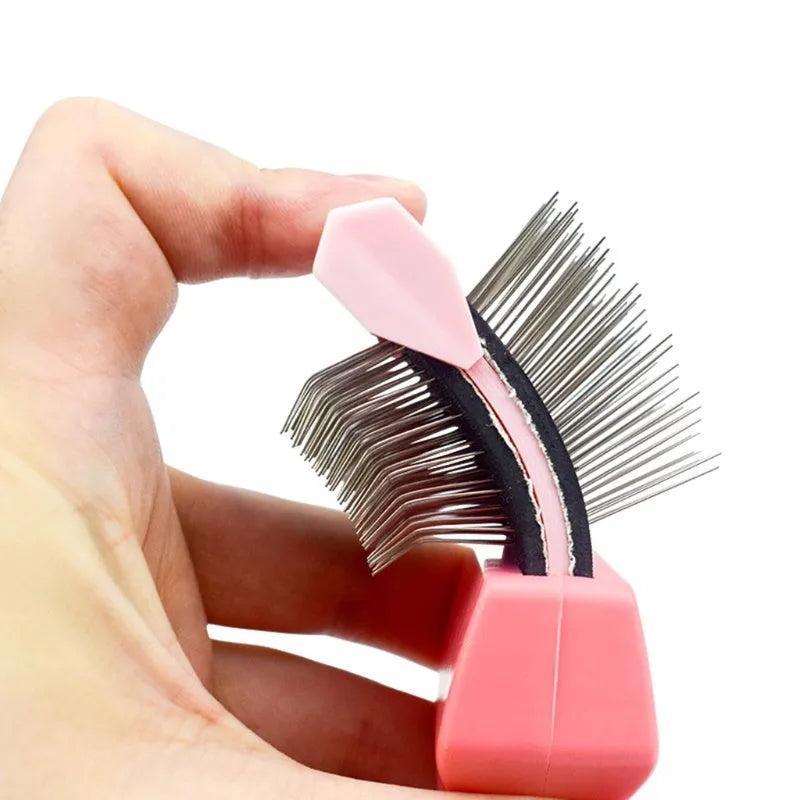 Double-sided pet grooming brush with stainless steel pins and blue ergonomic handle
