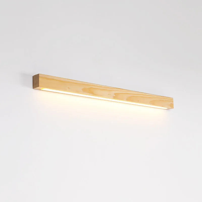 Walnut colour minimalist wooden and acrylic strip wall lamp in three length options on a white wall.