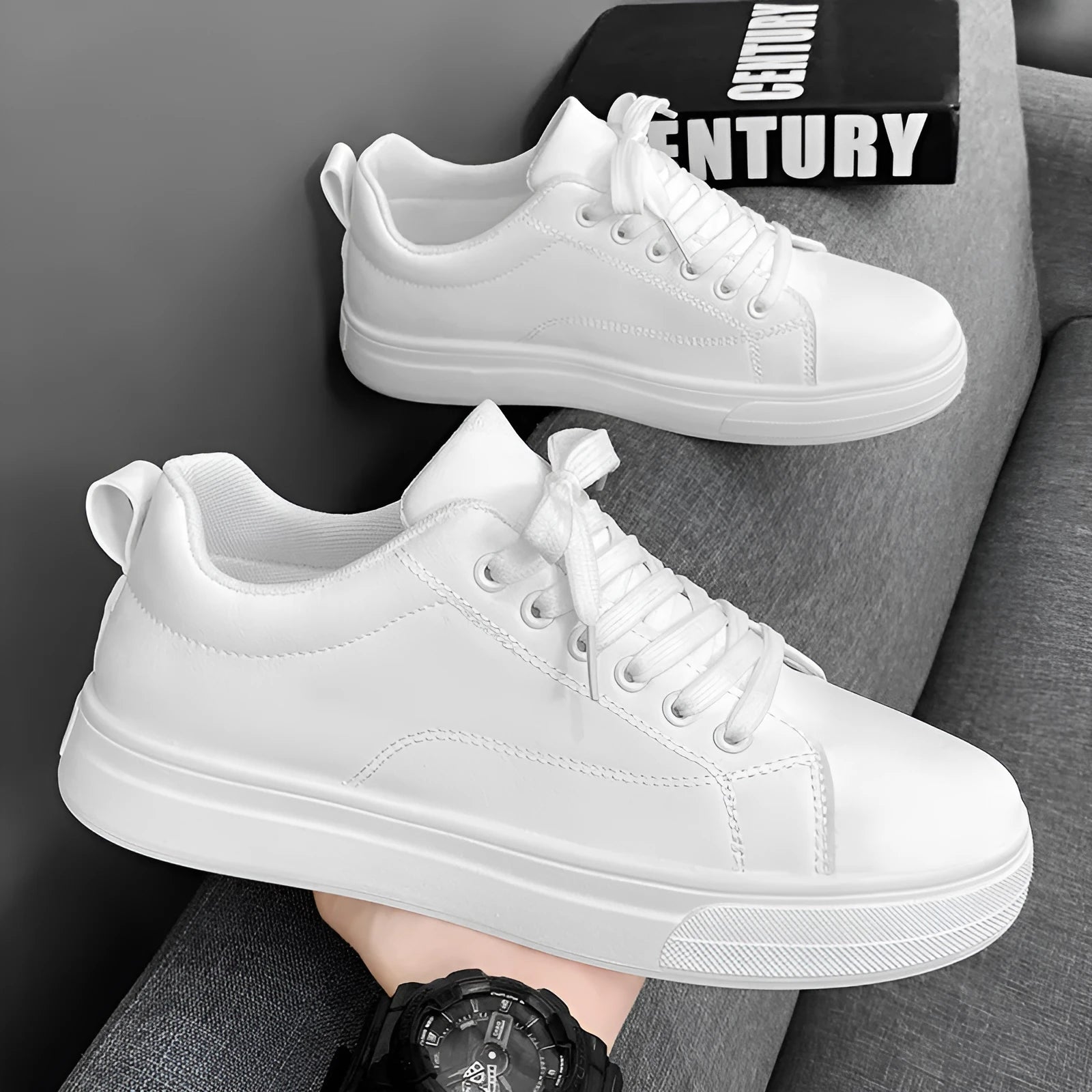 Men's low-top white breathable sneakers with a rubber sole on a plain background