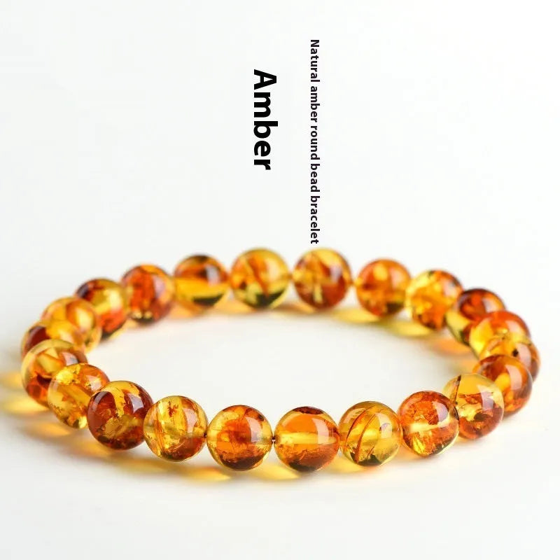 Natural yellow piebald amber bracelet with geometric polished beads showing flower spot patterning