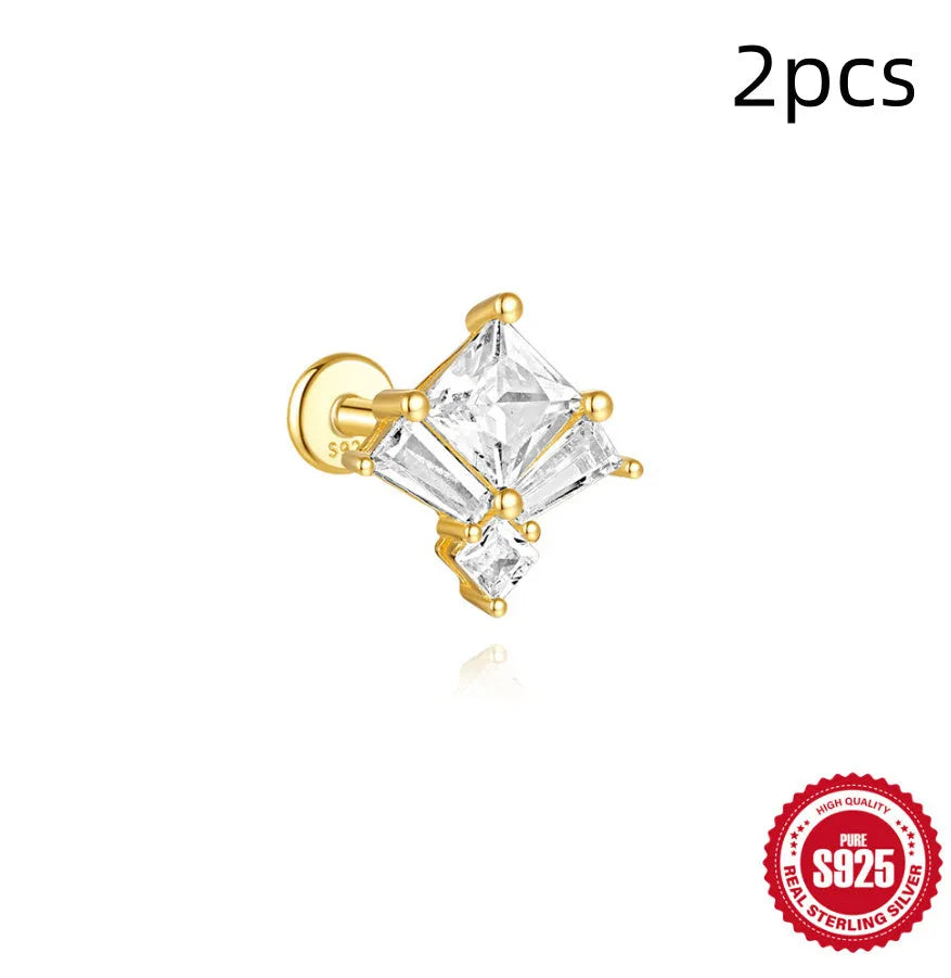 Close-up of a golden double ear piercings chain design stud earring made from S925 sterling silver with inlaid zircon stone.