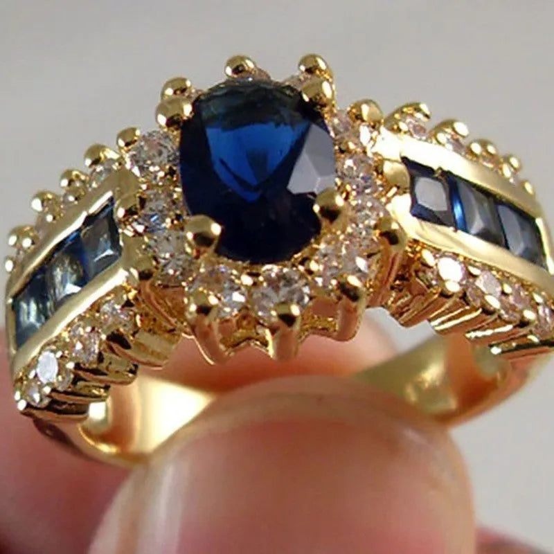 Personalised zinc alloy fashion ring with diamond and blue or purple zircon stone designs.