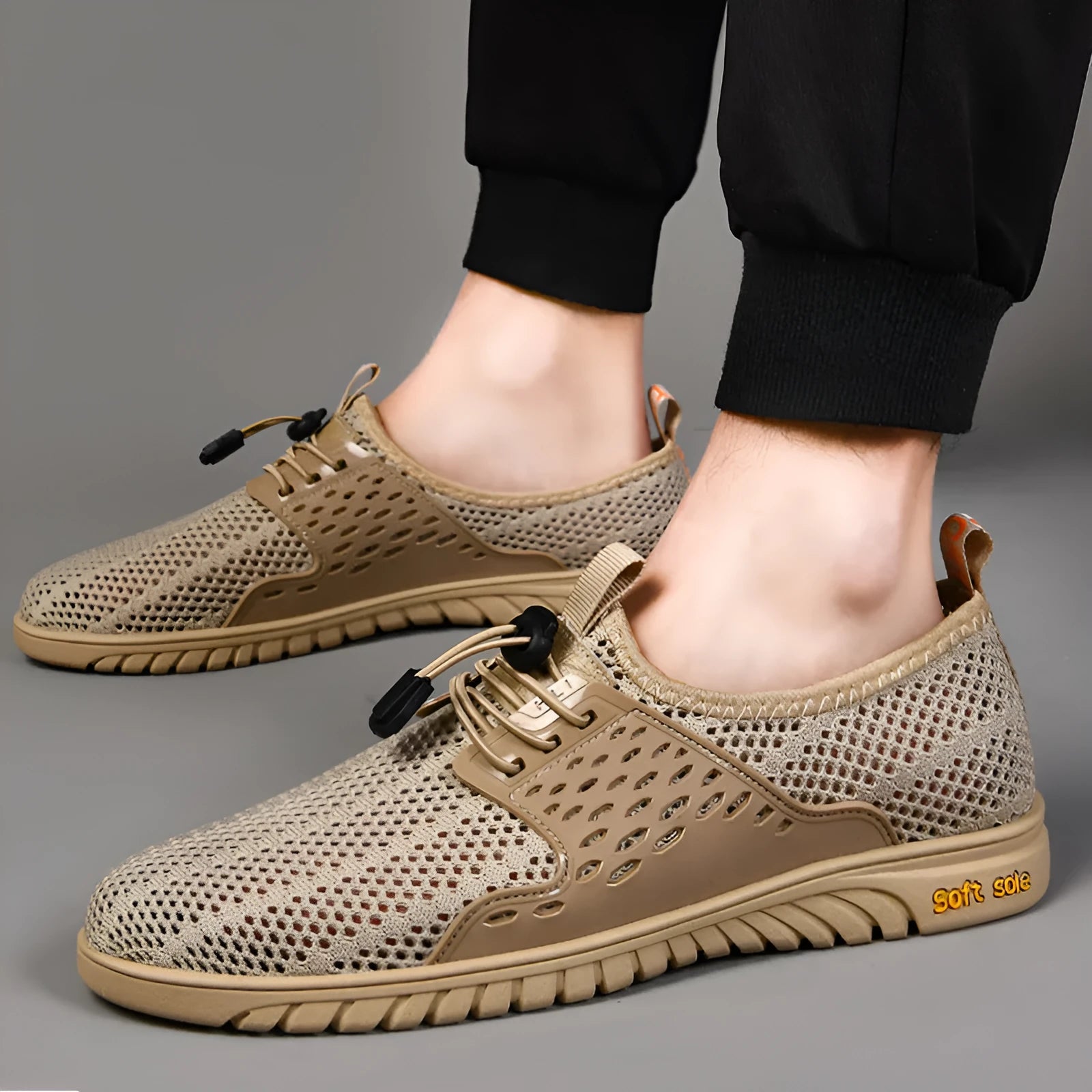 Men's black mesh casual shoes with elastic closure and round toe design