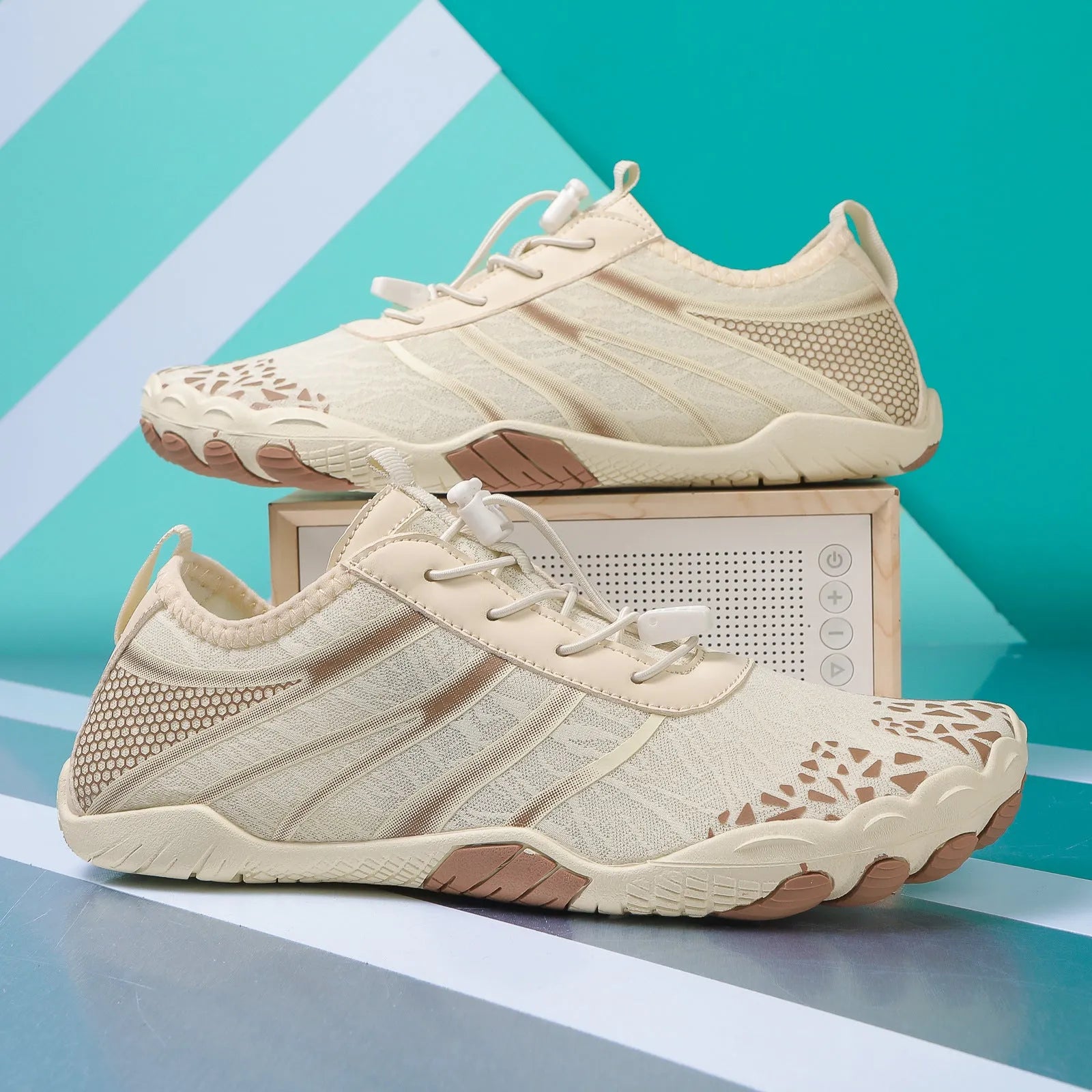 Pair of casual unisex running shoes with Lycra stretch fabric upper, shown in beige colour.
