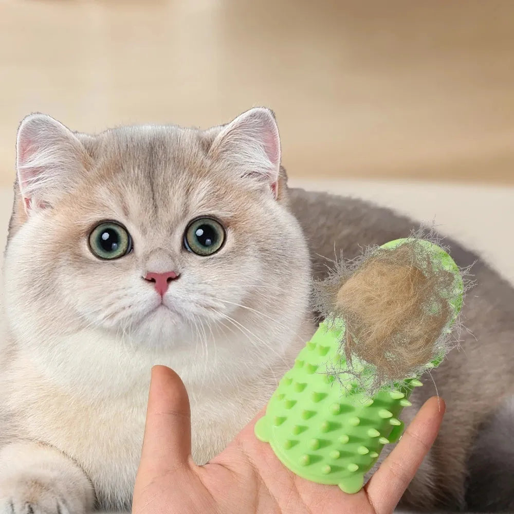 Silicone cat grooming comb with adjustable strap fastened to a table leg for self-cleaning