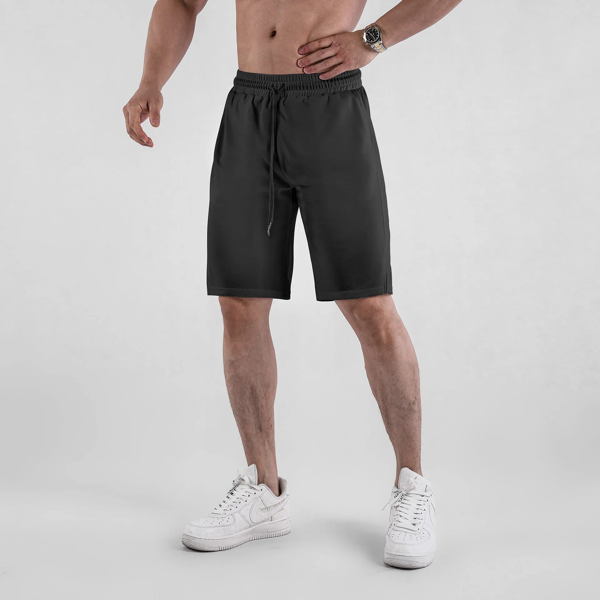 Men's black quick-drying mesh shorts with elastic waistband and loose fit for summer sports