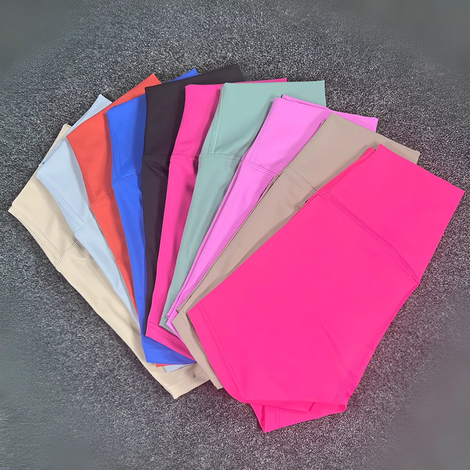 Ladies high-waisted yoga shorts in nylon fabric, shown in one of 16 available colours.
