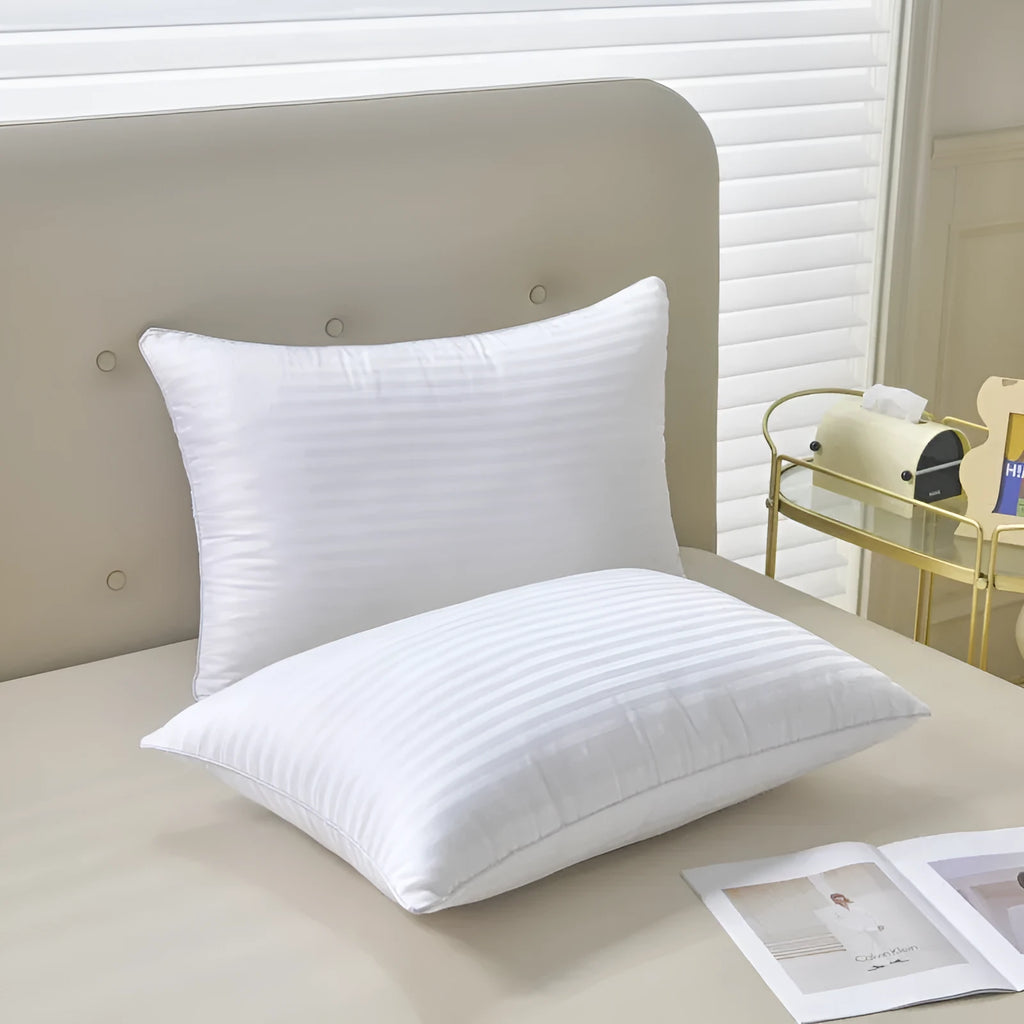 White cotton satin stripe pillow with feather cotton fill showing three size options