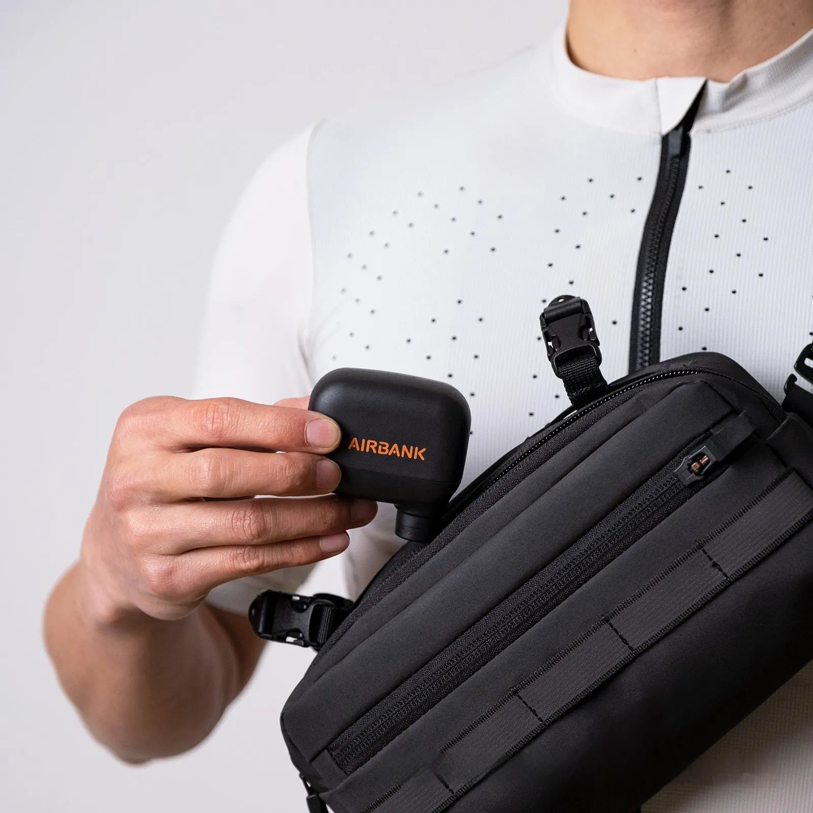 Black plastic electric bike pump with USB charging port and waterproof storage bag