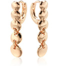 A pair of long gold-colour retro earrings with a woven round circle design made from copper.