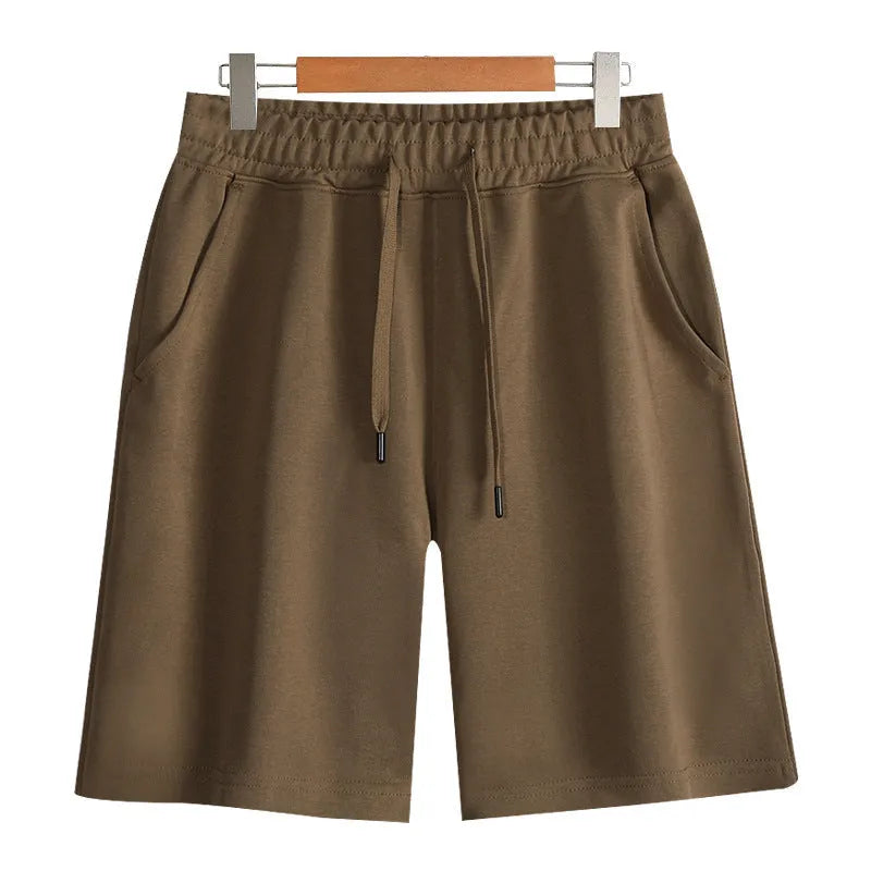 Cotton micro-elastic sports shorts in straight cut fifth length design on hanger