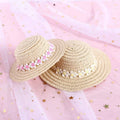 Cartoon-style adjustable paper hat for dog or cat on a neutral background, showing bowknot detail.