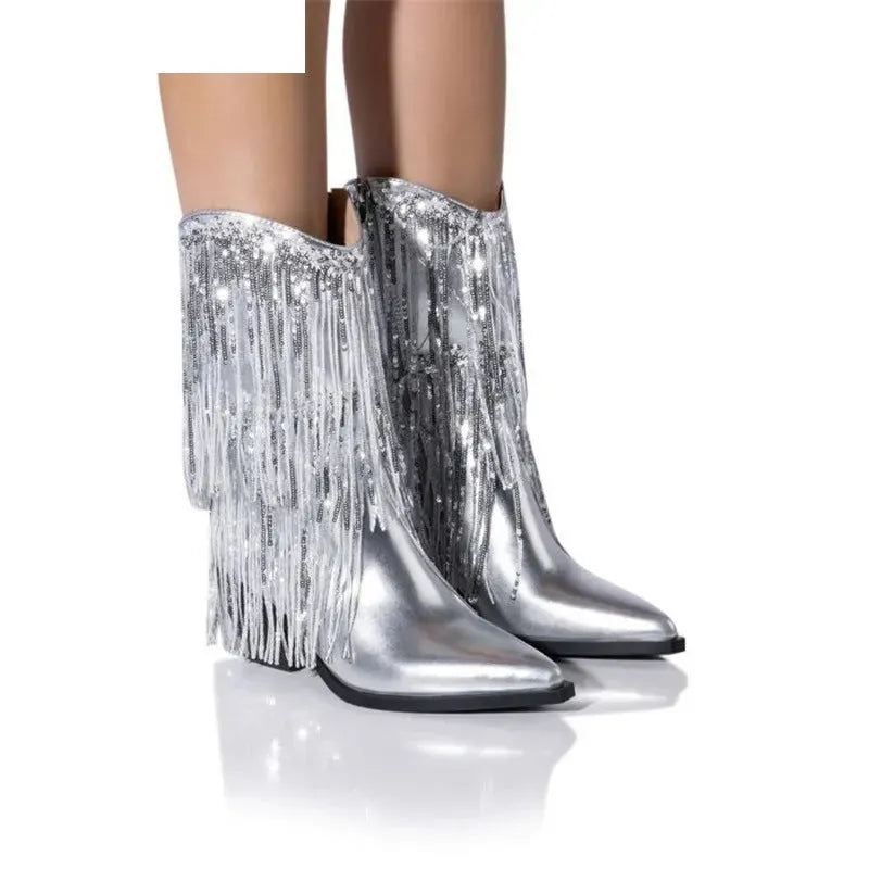 Women's brown chunky heel boots with tassels and pointed toe on a white background.