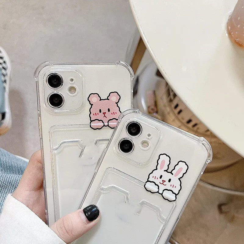 Transparent cartoon graphic iPhone back cover case with a slot for holding credit cards.