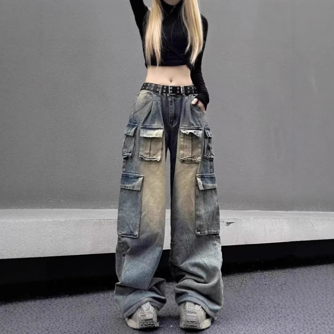 Light blue loose-fit multi-pocket distressed jeans on a hanger
