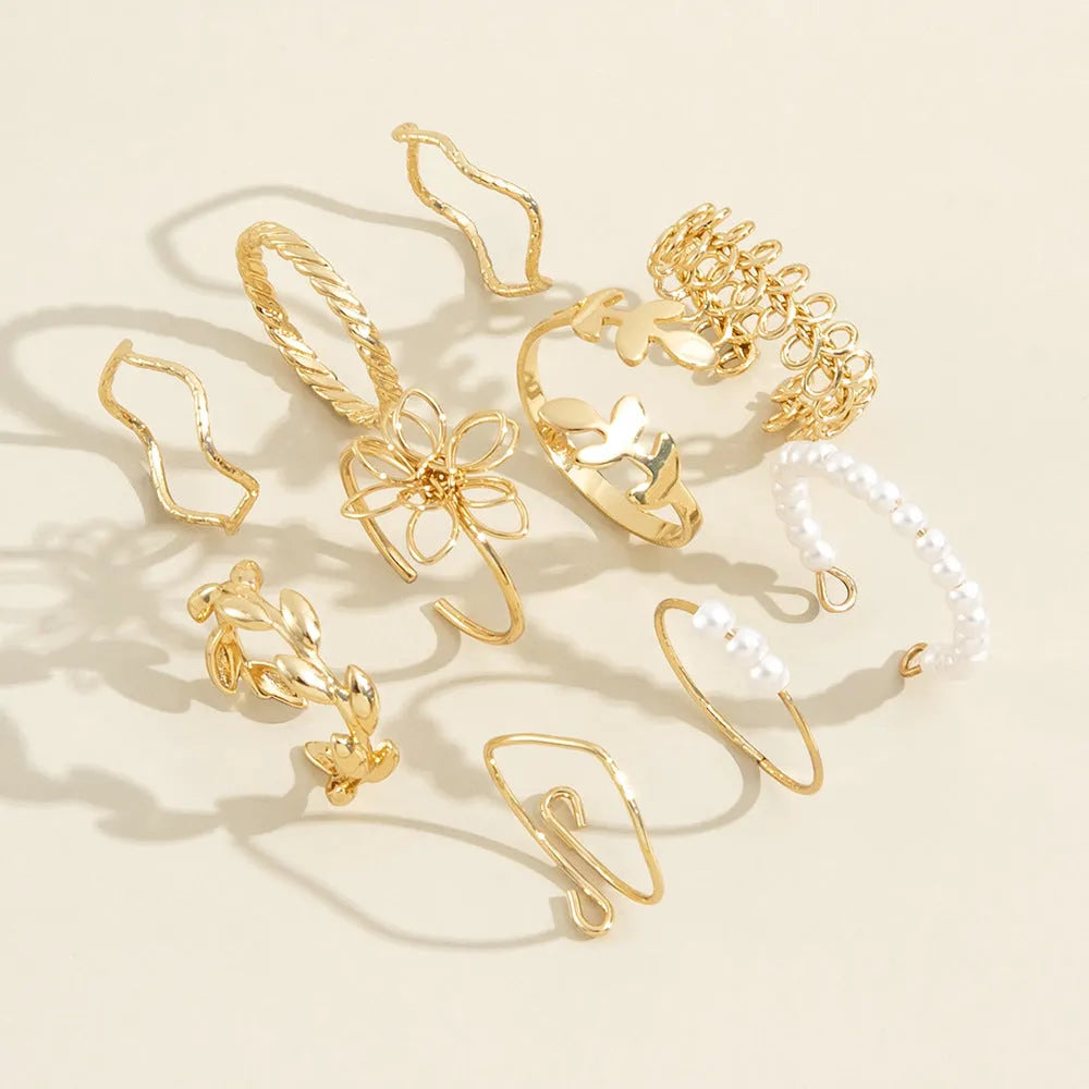 Openwork flower design ring set in glossy gold alloy for women