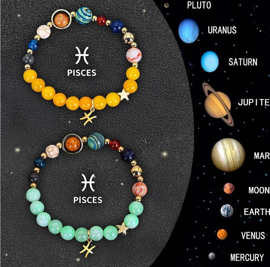 Two natural stone beaded bracelets with zodiac sign charms on a wooden surface.