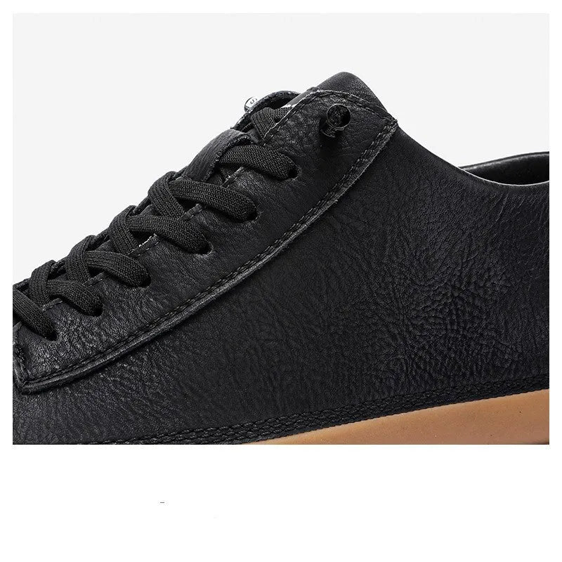 Men's black leather casual lace-up shoes with a round toe and flat rubber sole on a white background.