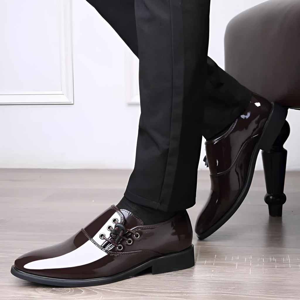 Men's black and brown formal business shoes with round toe and square heel on a rubber sole.