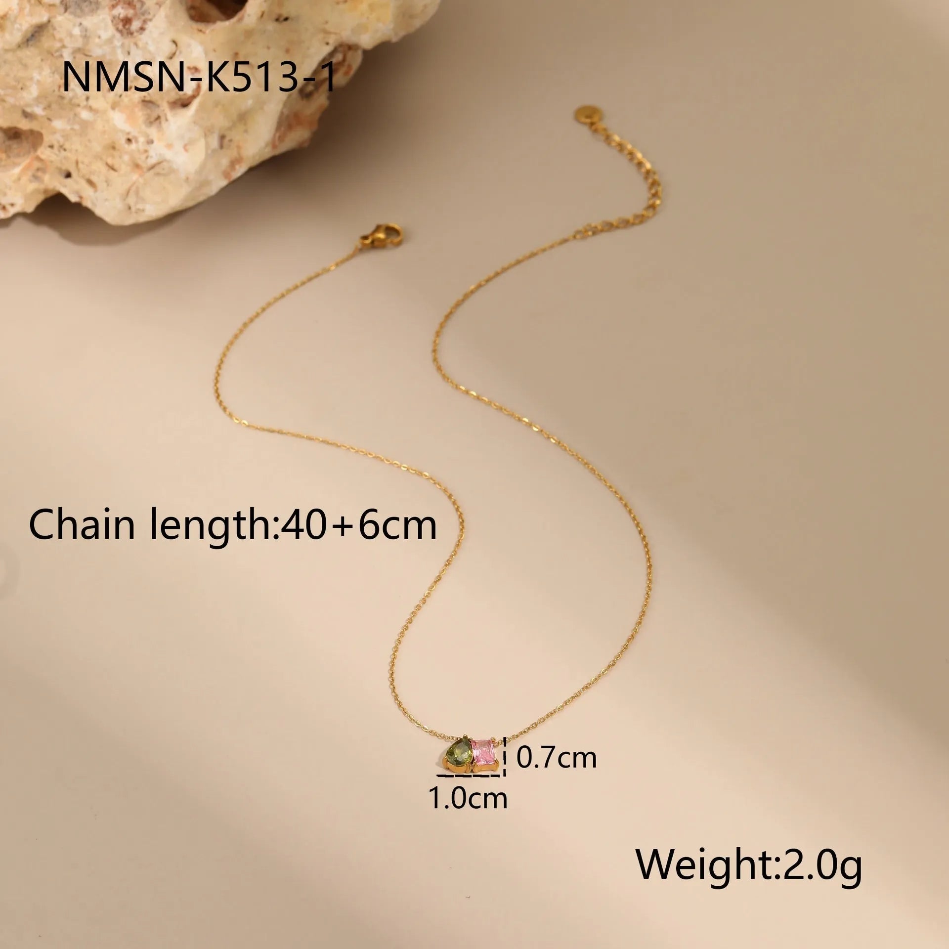 Geometric gold plated jewellery set showing necklace, ring, and earrings with chain-style design