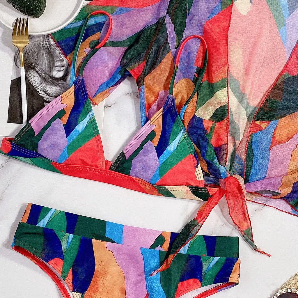 Red printed split swimsuit bikini for women on a mannequin