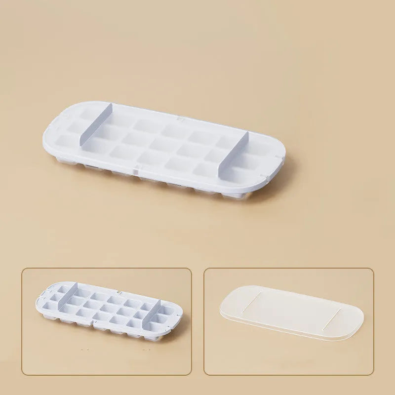 Blue food-grade plastic ice cube tray with grid design and integrated ice shovel storage.
