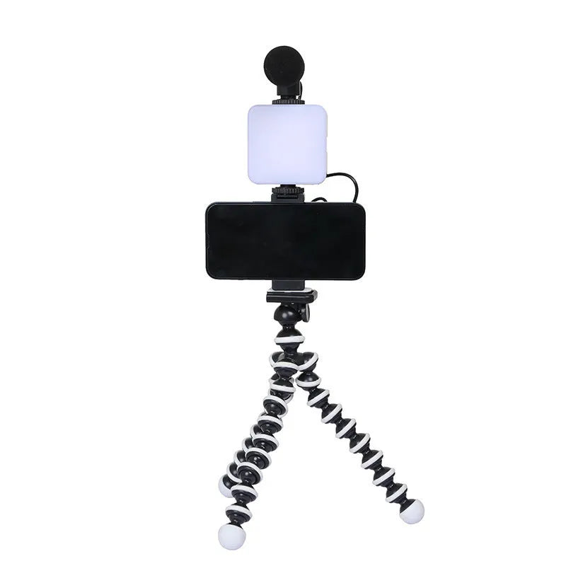 LED mini square universal camera flash on a pocket tripod, showing compact size and rotatable flash head.