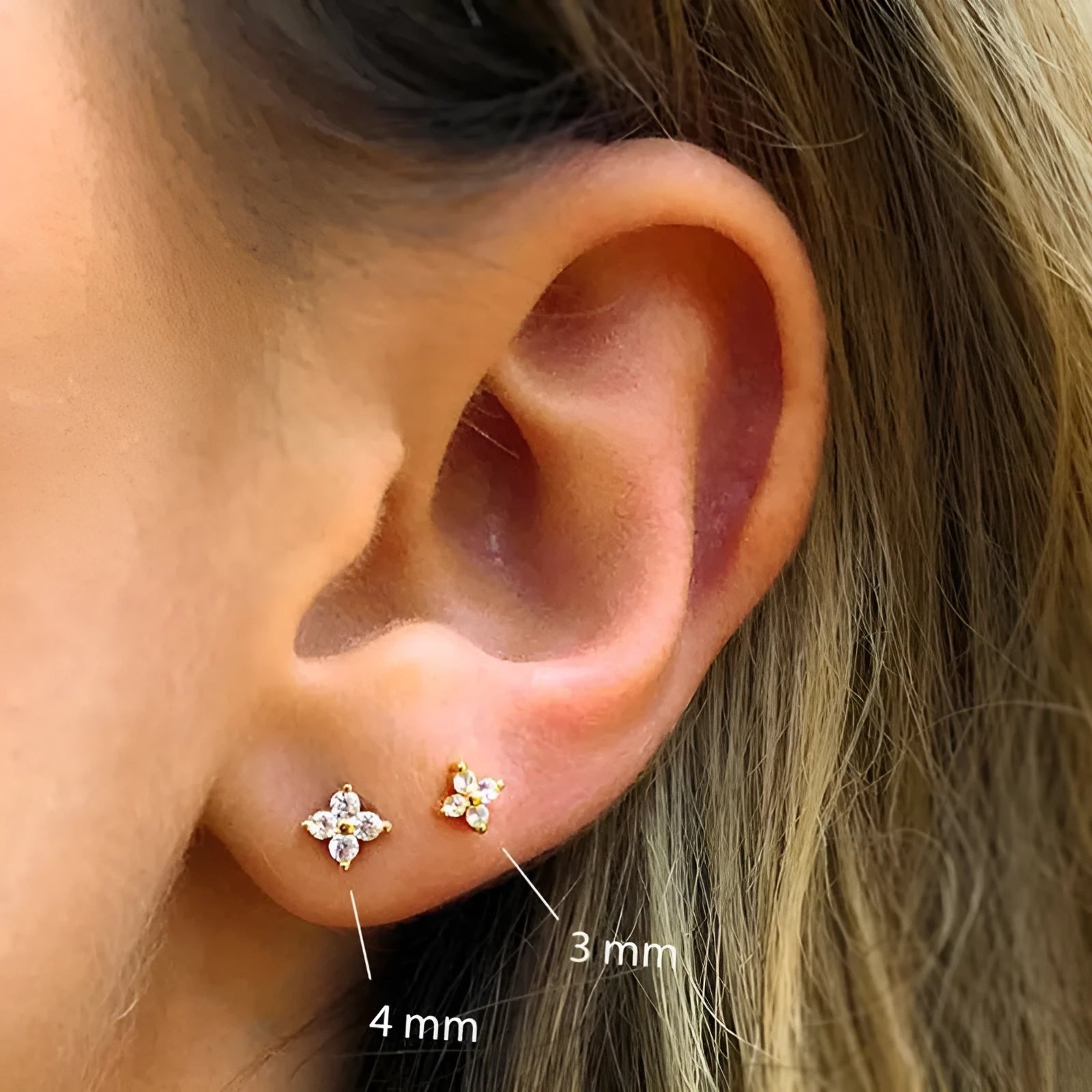 S925 sterling silver stud earrings with a geometric petal crystal flower design in gold or platinum finish.