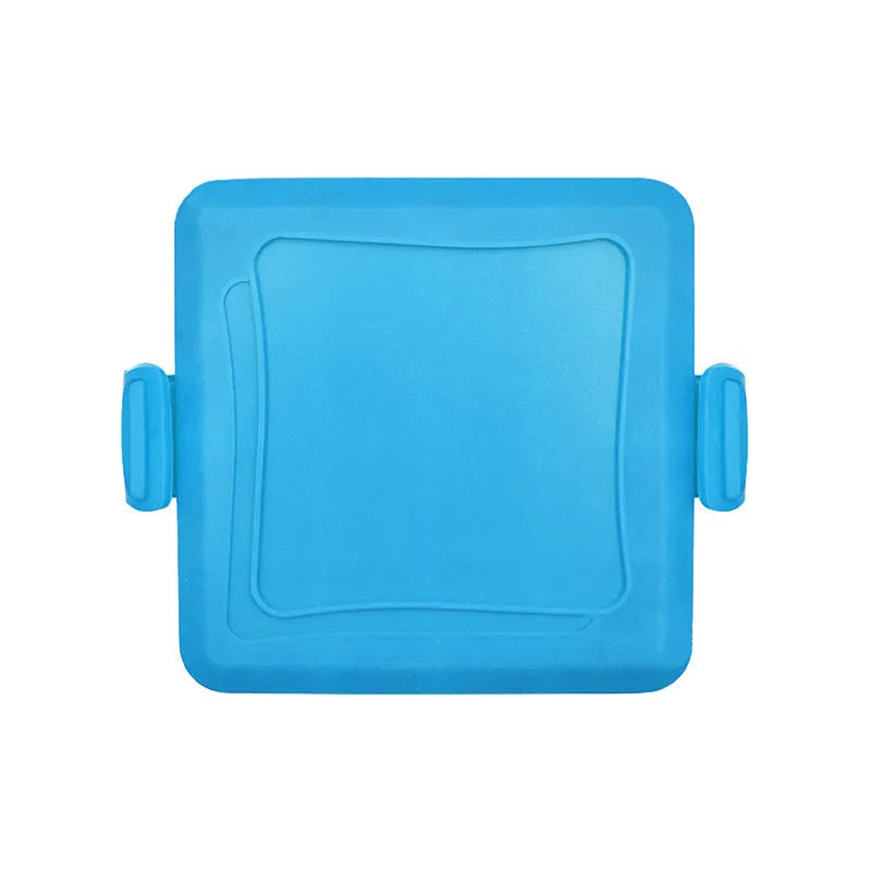 Red silicone baking tray with matching heat-resistant gloves on kitchen counter