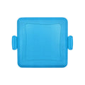 Red silicone baking tray with matching heat-resistant gloves on kitchen counter