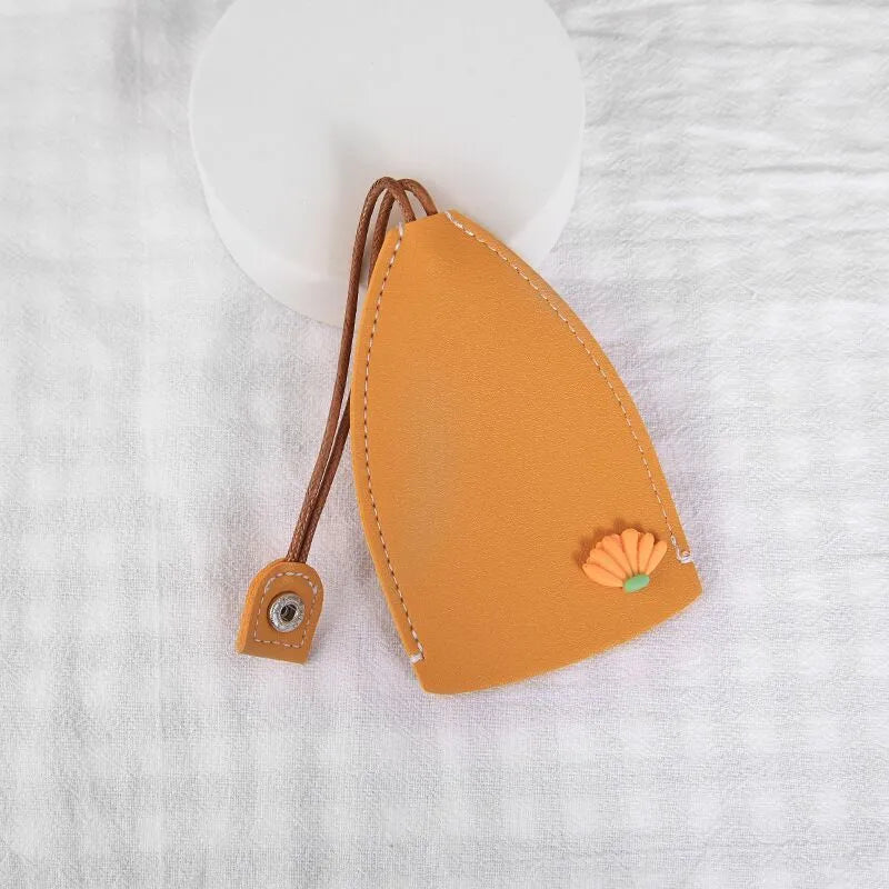 Cartoon design pull-out car key case made from soft PU leather, showing approximate size.
