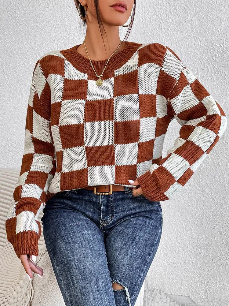Dark brown plaid acrylic pullover sweater with round neck and long sleeves on hanger