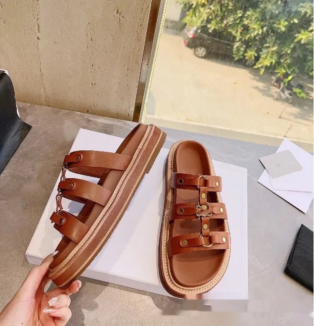Women's white patent leather Roman sandal slippers with sheepskin lining shown from the side.