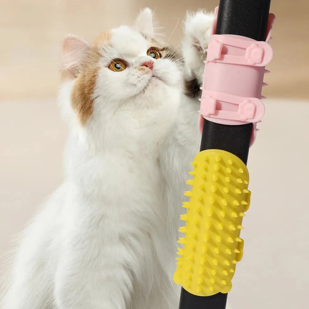 Silicone cat grooming comb with adjustable strap fastened to a table leg for self-cleaning