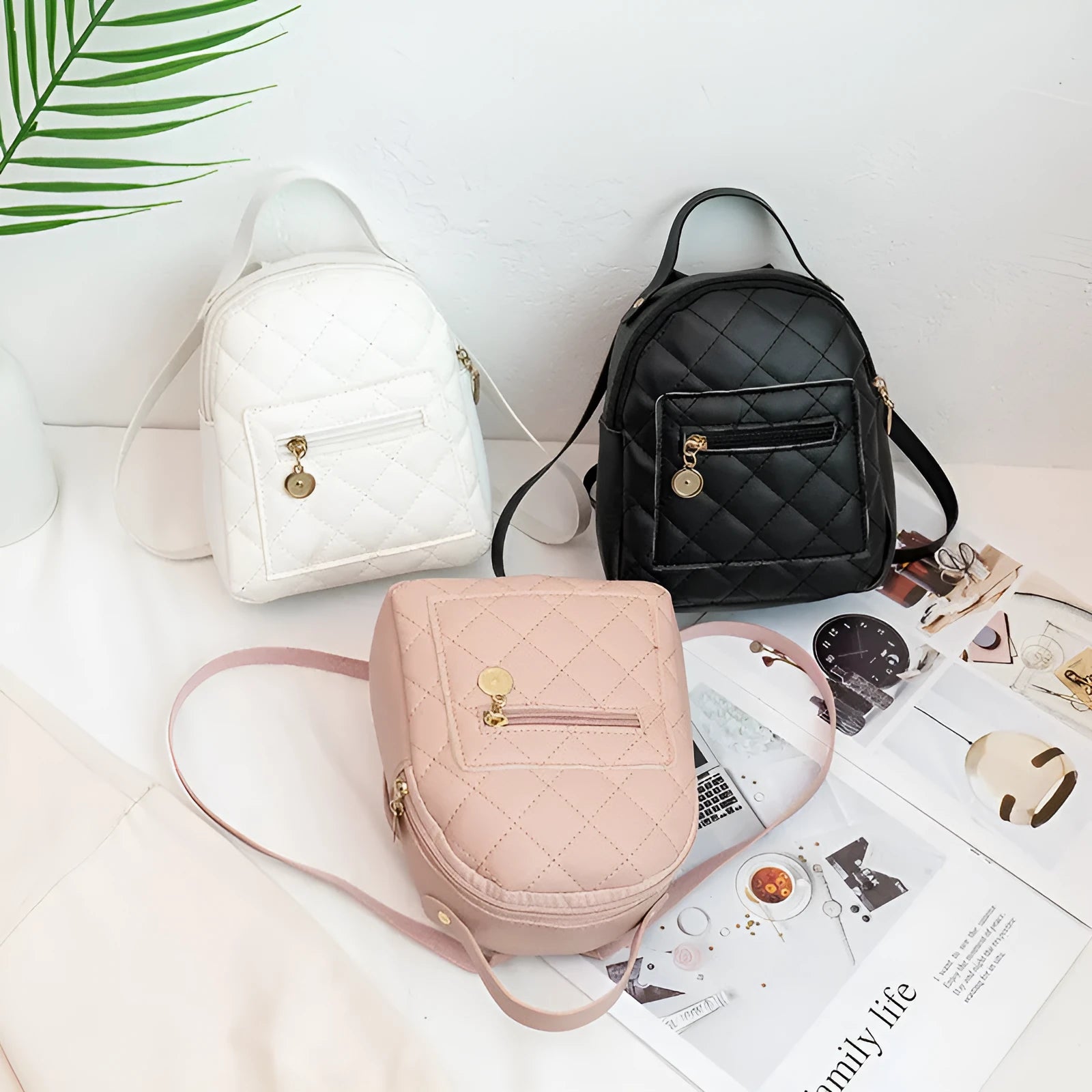 Girls' hard shell backpack with embroidery in black, pink, or white colours showing square shape and sandwich pocket