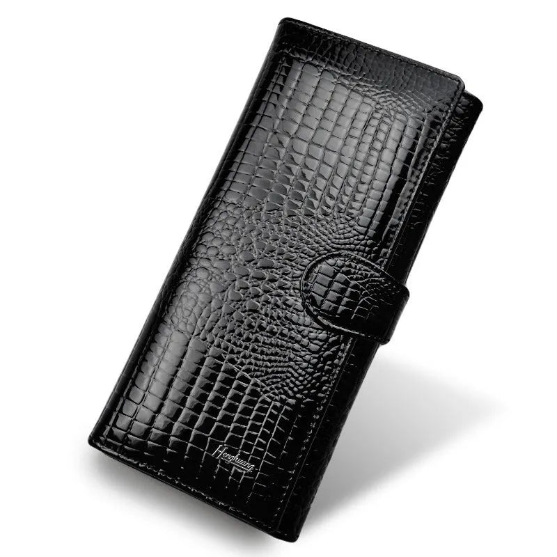 Women's red leather coin purse with a textured crocodile pattern, shown open to reveal pigskin lining.