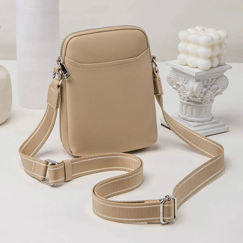 Solid colour PU leather crossbody phone bag for women shown in beige.