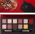 Explorer twelve-colour animal eye shadow palette open, showing pressed powder shades including cat, golden tiger and red fox.