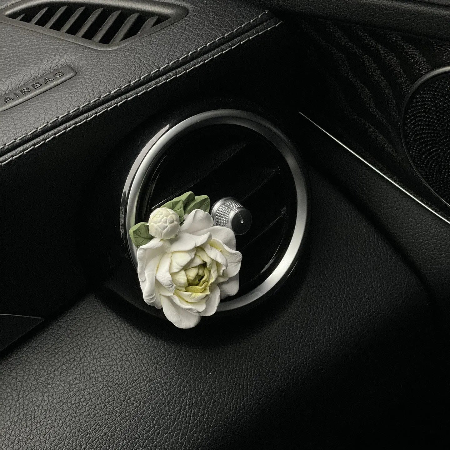 Jasmine scented solid gypsum car air vent diffuser in off white or green.