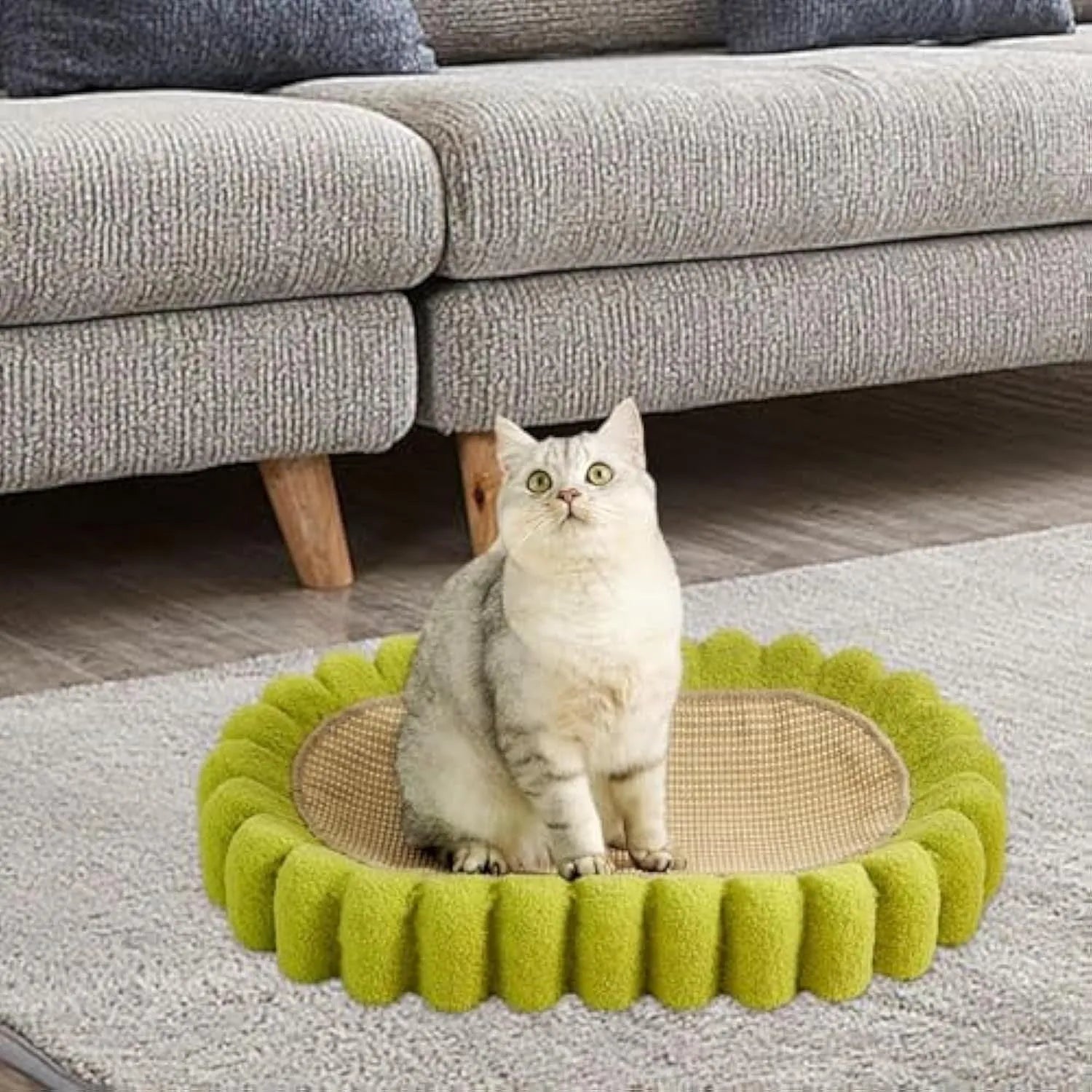 Green oval cat scratcher bowl bed with sisal scratching surface measuring 65cm