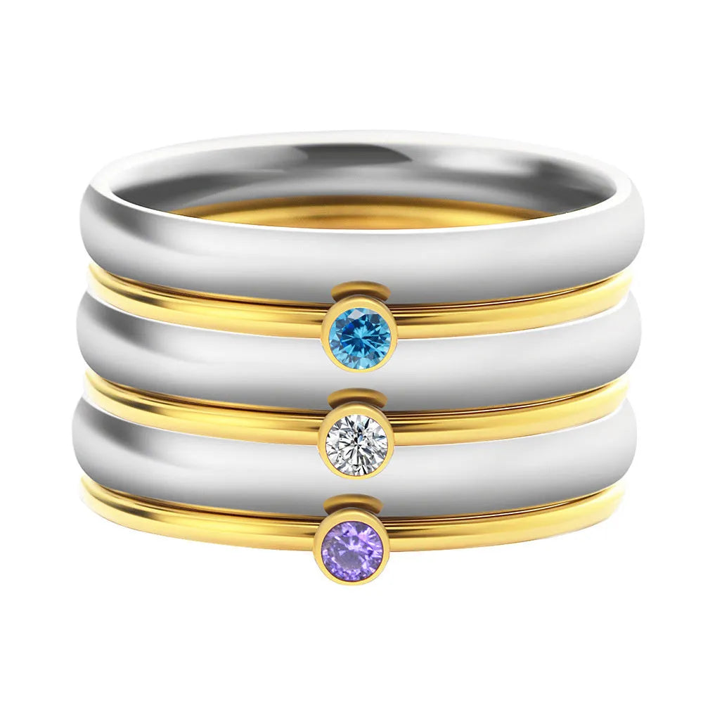 Geometric titanium steel ring featuring an engraved December birthstone design on a finger.