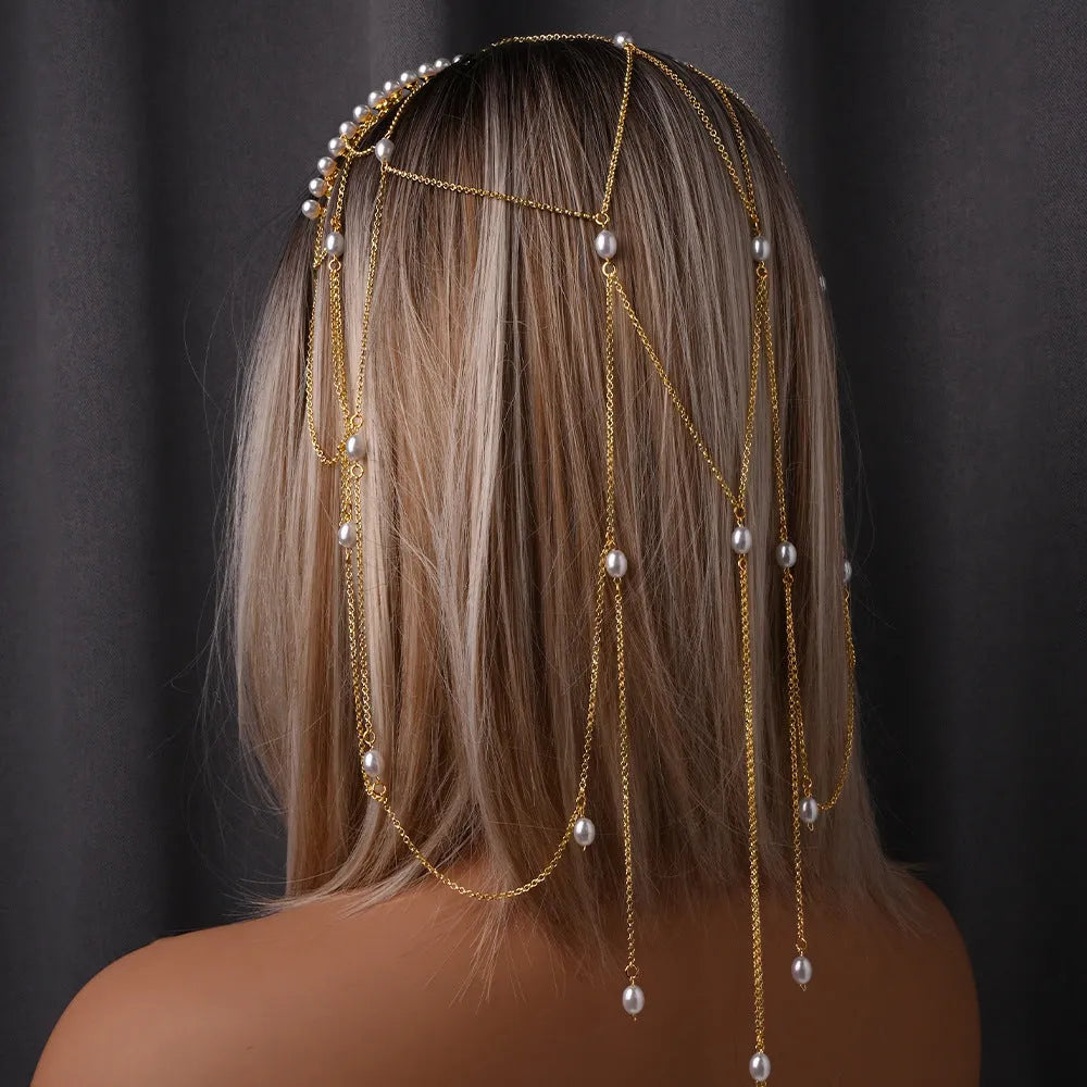 Women's gold mesh tassel hair chain with pearl decorations on dark hair